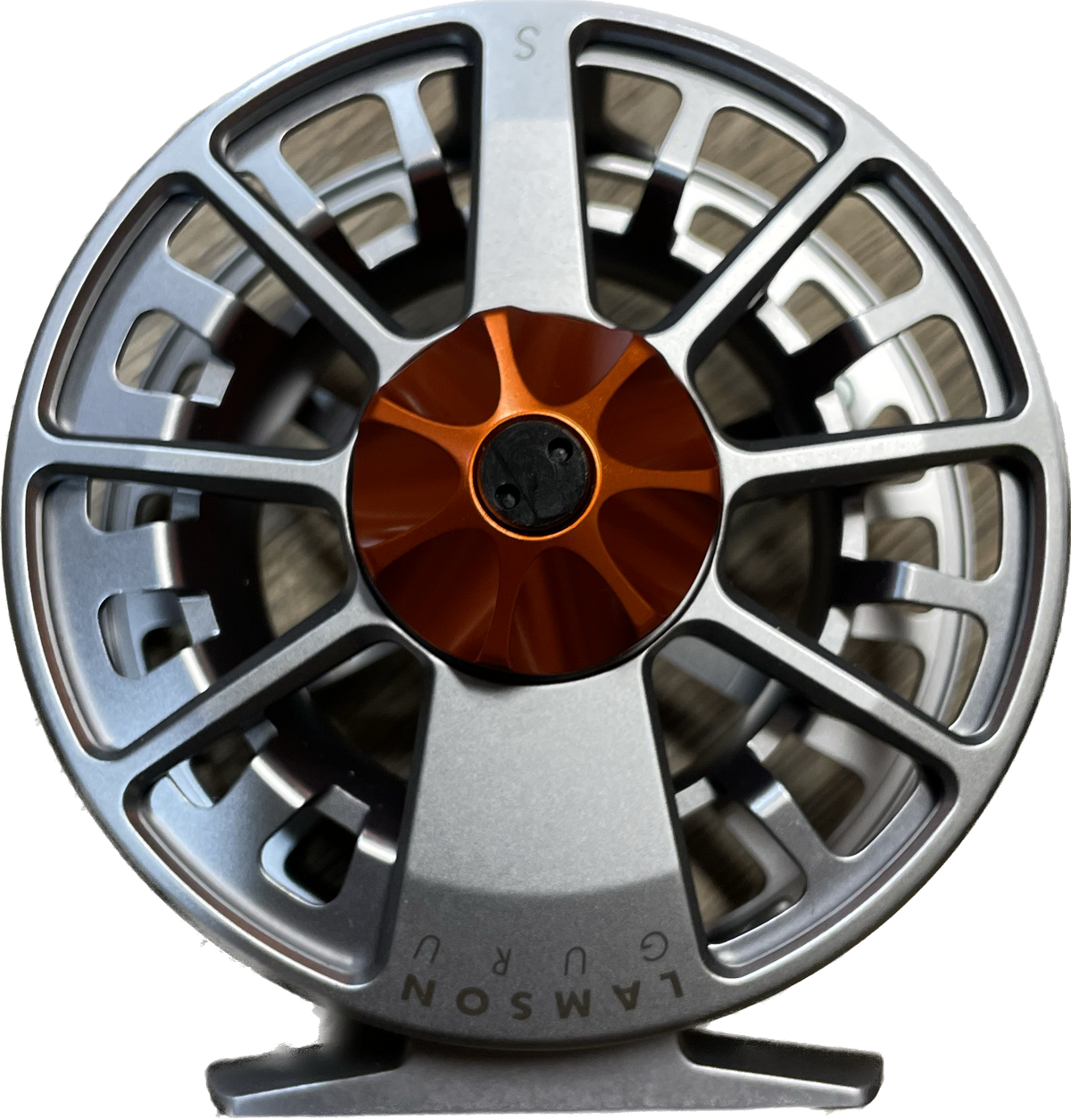 The Waterworks Lamson 5 weight fly reel. Platinum Arbor and Reel with a blaze orange drag knob.