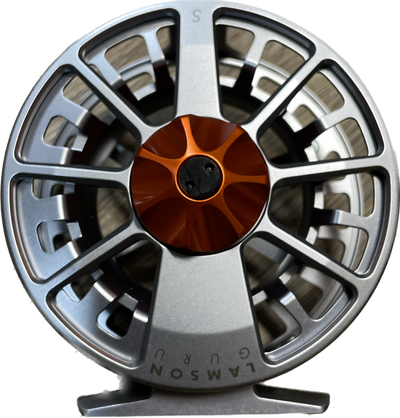 The Waterworks Lamson 5 weight fly reel. Platinum Arbor and Reel with a blaze orange drag knob.