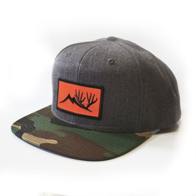 Ball Cap with Camo Brim, Grey Forehead and Back, with a Orange Altitude Outdoors patch on Forehead.